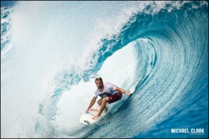 Pro surfer Dylan Longbottom surfing a sizable wave at Teahupo'o, Tahiti by Michael Clark.